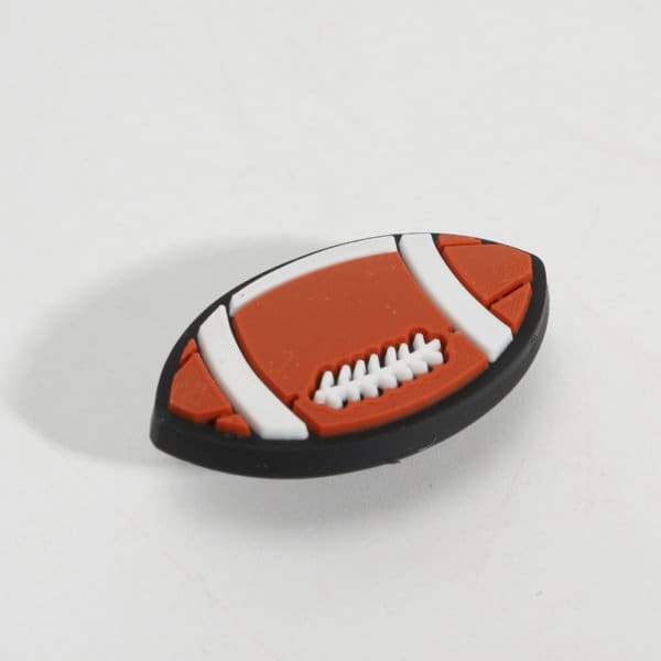A PVC ornament shaped like an Australian football, featuring orange, white, and black colours. A PVC ornament shaped like an Australian football, featuring orange, white, and black colours.