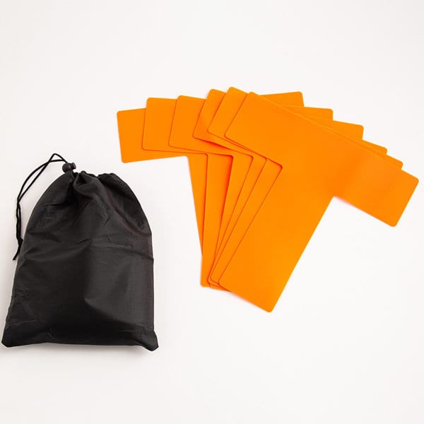 A black storage bag next to several orange pickleball court marker lines on a white background. A black storage bag next to several orange pickleball court marker lines on a white background.