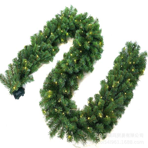 A green rattan garland with warm white lights, featuring a flexible design suitable for decoration. A green rattan garland with warm white lights, featuring a flexible design suitable for decoration.