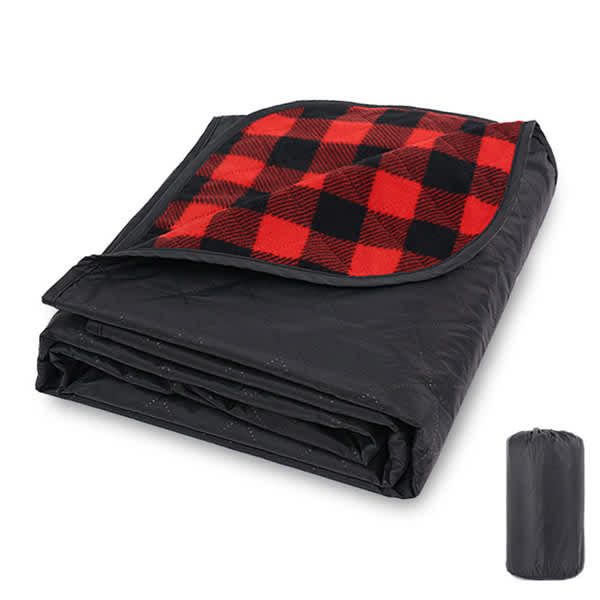 A folded waterproof outdoor blanket with a black underside and a red and black checkered top, alongside a carrying pouch. A folded waterproof outdoor blanket with a black underside and a red and black checkered top, alongside a carrying pouch.