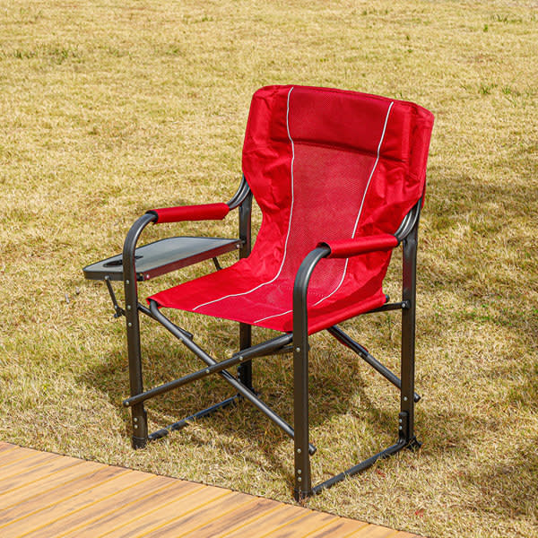 A red camping chair with a side table and bottle holder, featuring a sturdy metal frame. A red camping chair with a side table and bottle holder, featuring a sturdy metal frame.
