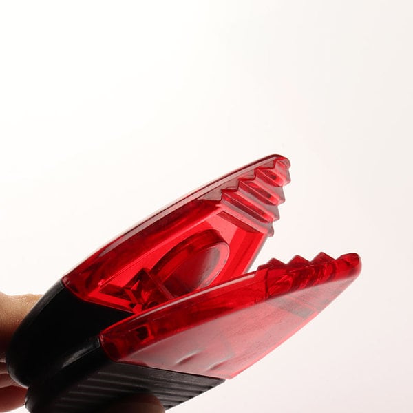 A red magnetic memo clip with a black handle, designed for holding notes or papers securely. A red magnetic memo clip with a black handle, designed for holding notes or papers securely.