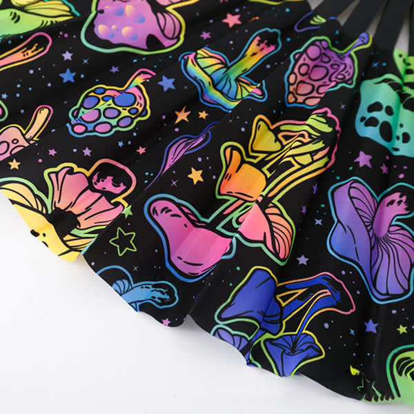 A vibrant black fan featuring colourful, glow-in-the-dark mushroom and floral designs, with a logo present. A vibrant black fan featuring colourful, glow-in-the-dark mushroom and floral designs, with a logo present.