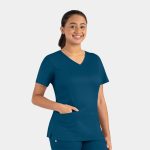 A women's double V-neck top in teal, featuring short sleeves and a pocket, with a logo on the side.