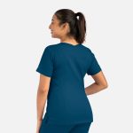 A woman's double v-neck top in dark teal, featuring short sleeves and a logo on the side.