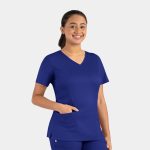 A woman wearing a blue double V-neck top with short sleeves and a front pocket, featuring a logo.