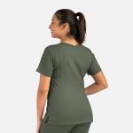 A woman wearing an olive green double V-neck top, showcasing the back design of the garment.