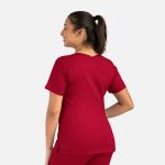 A red women's double V-neck top with short sleeves, featuring a logo on the sleeve.