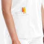 A white women's top with a double V-neck design, featuring orange and green pens in the pocket.