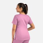 A women's double V-neck top in a light pink colour, featuring a fitted design and short sleeves, with a logo on it.