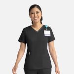 A black women's top with a double V-neck and short sleeves, featuring a pocket and a badge holder.