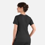 A woman wearing a black Matrix Women's Contrast Double V-Neck Top, showing a clean back design with subtle detailing.