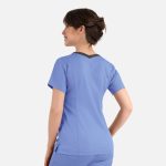 A women's double V-neck top in blue with a contrasting back and short sleeves. The top features a logo.