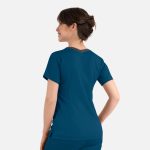 A women's double V-neck top in teal, featuring short sleeves and a contrasting neckline, with a logo on the back.