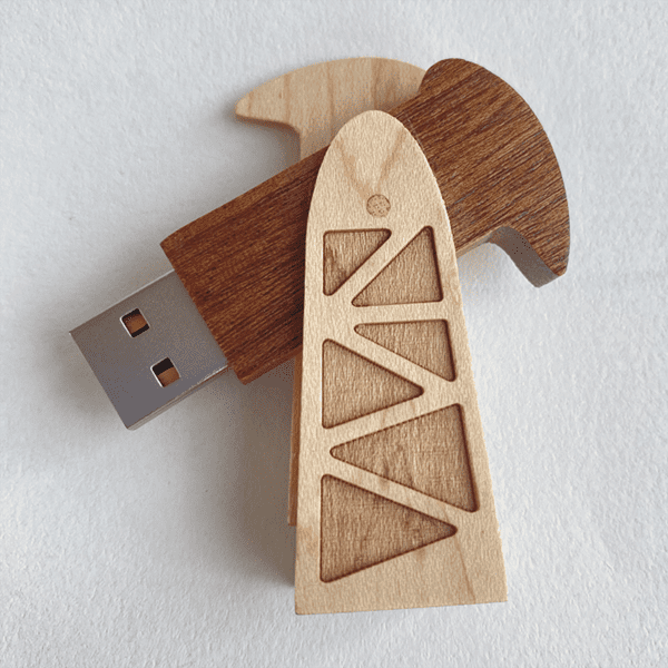 A USB flash drive designed as a pumping unit, featuring wood textures in brown and light wood tones. A USB flash drive designed as a pumping unit, featuring wood textures in brown and light wood tones.