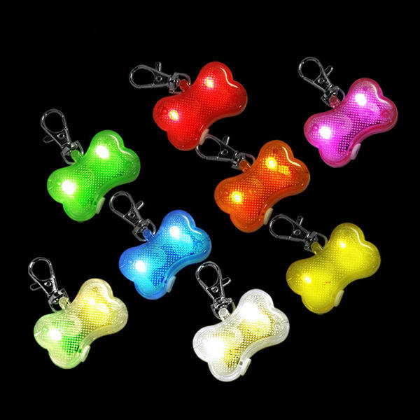 A collection of LED clip-on pet safety lights in various colours including red, green, blue, yellow, and pink. A collection of LED clip-on pet safety lights in various colours including red, green, blue, yellow, and pink.
