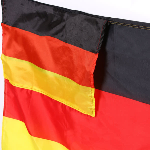 A flag featuring horizontal stripes in red, black, and yellow, with a fabric texture and a logo in one corner. A flag featuring horizontal stripes in red, black, and yellow, with a fabric texture and a logo in one corner.