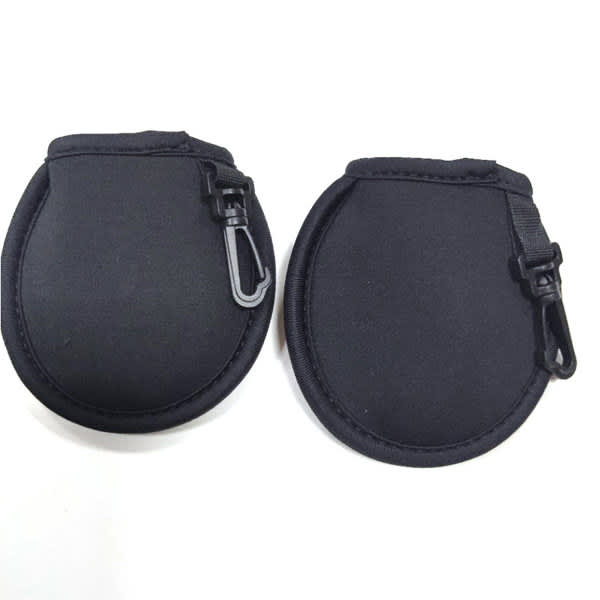 A black golf ball cleaning pouch with a clip, featuring a smooth, rounded design and a zip closure. A black golf ball cleaning pouch with a clip, featuring a smooth, rounded design and a zip closure.