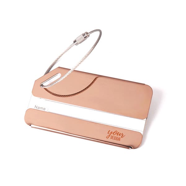 A personalised metal luggage tag in rose gold with a silver stripe and a cable attachment for secure fastening. A personalised metal luggage tag in rose gold with a silver stripe and a cable attachment for secure fastening.