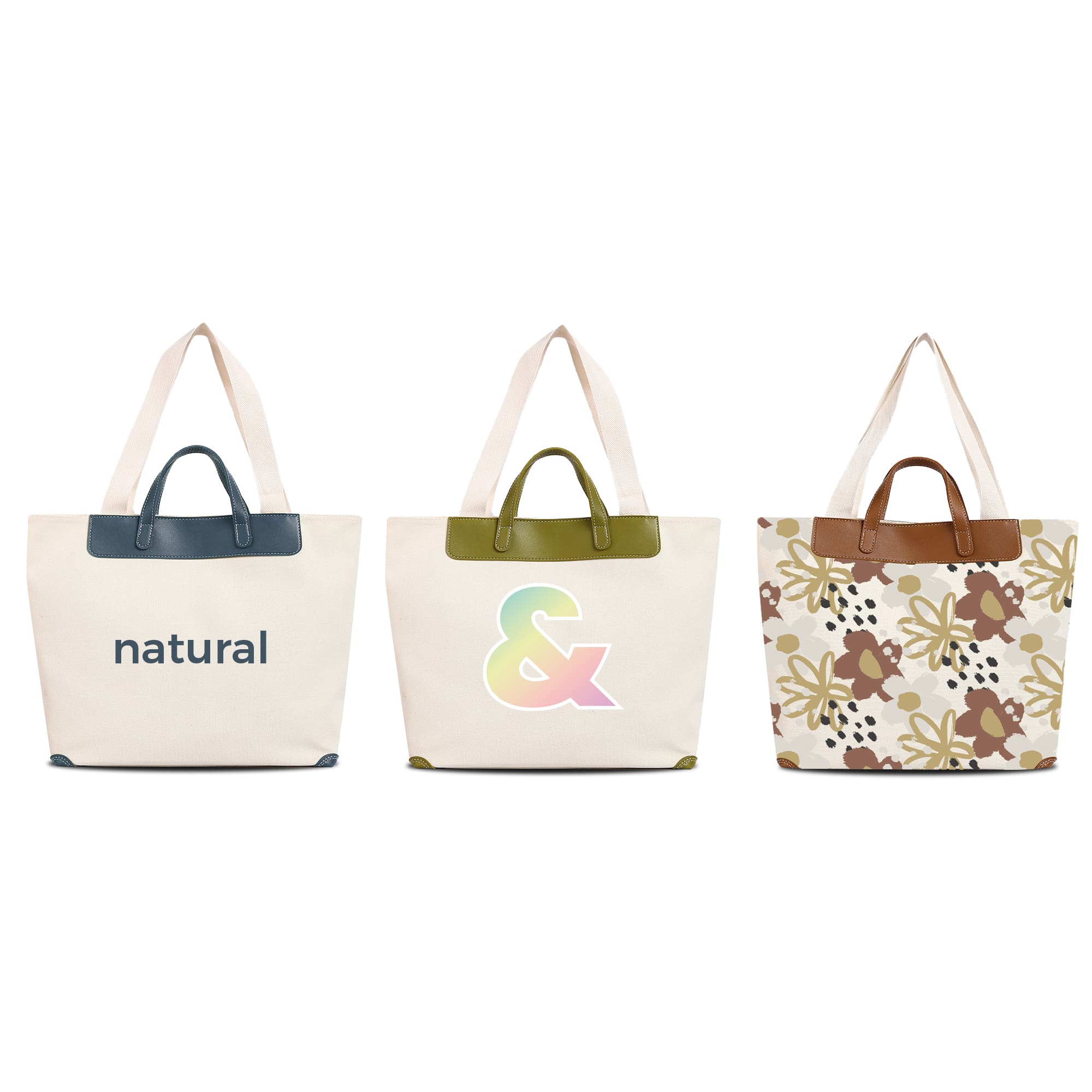 Three canvas bags with leather handles in cream, featuring different designs: text, a colourful symbol, and floral patterns. Canvas Bag With Leather Handle - Image 1