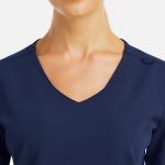 A women's navy V-neck top with metallic detail, featuring a sleek design and subtle branding.
