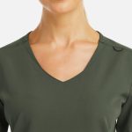 A women's v-neck top in olive green with a metallic detail and a simple neckline design.
