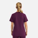 A purple women's top with short sleeves and a curved hem, featuring a simple design and no visible logos.