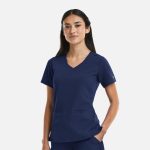 A women's curved V-neck top in navy blue, featuring short sleeves and front pockets, with a logo on the sleeve.