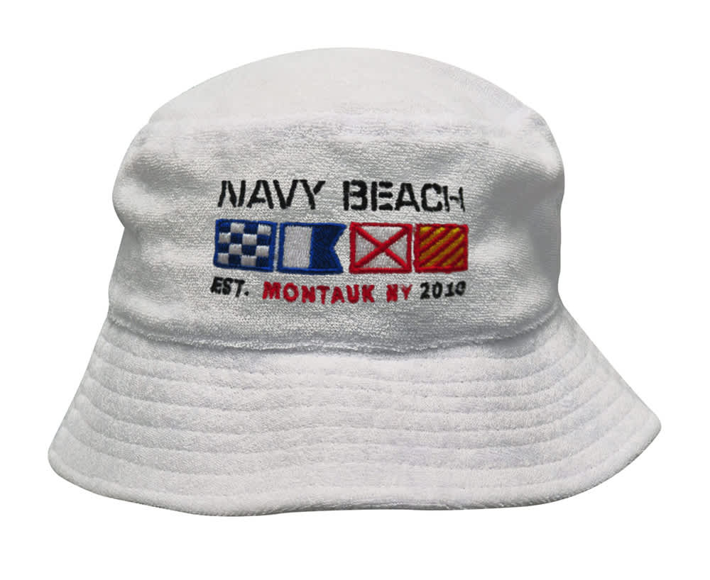 A white terry towelling bucket hat featuring decorative nautical flags and an embroidered logo. A white terry towelling bucket hat featuring decorative nautical flags and an embroidered logo.