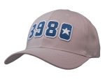 A beige cap featuring blue embroidered numbers and a star, with a logo on the side.