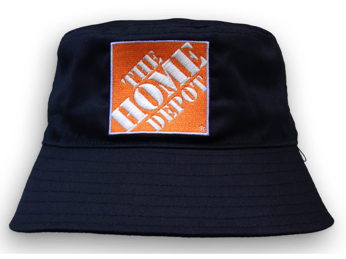 A navy blue bucket hat featuring a square logo on the front. The hat is made from breathable poly twill material. A navy blue bucket hat featuring a square logo on the front. The hat is made from breathable poly twill material.