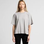 A light grey relaxed fit t-shirt featuring short sleeves. The design includes a subtle branding element.