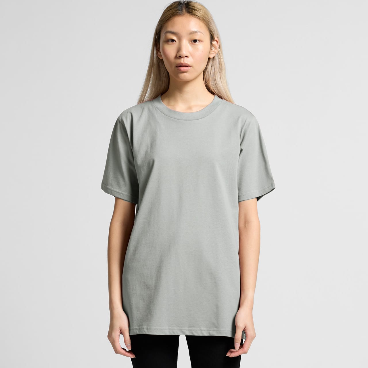 A light green women's t-shirt with a relaxed fit and short sleeves, featuring a logo. A light green women's t-shirt with a relaxed fit and short sleeves, featuring a logo.