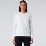 A long-sleeve white T-shirt featuring a fitted design, paired with dark jeans. It has a logo on the front.