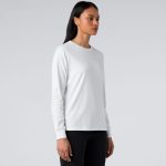 A long-sleeve white T-shirt displayed on a model, featuring a simple design and a logo.