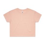 A cropped tee in a soft peach colour with a relaxed fit and short sleeves. It features a branding label.