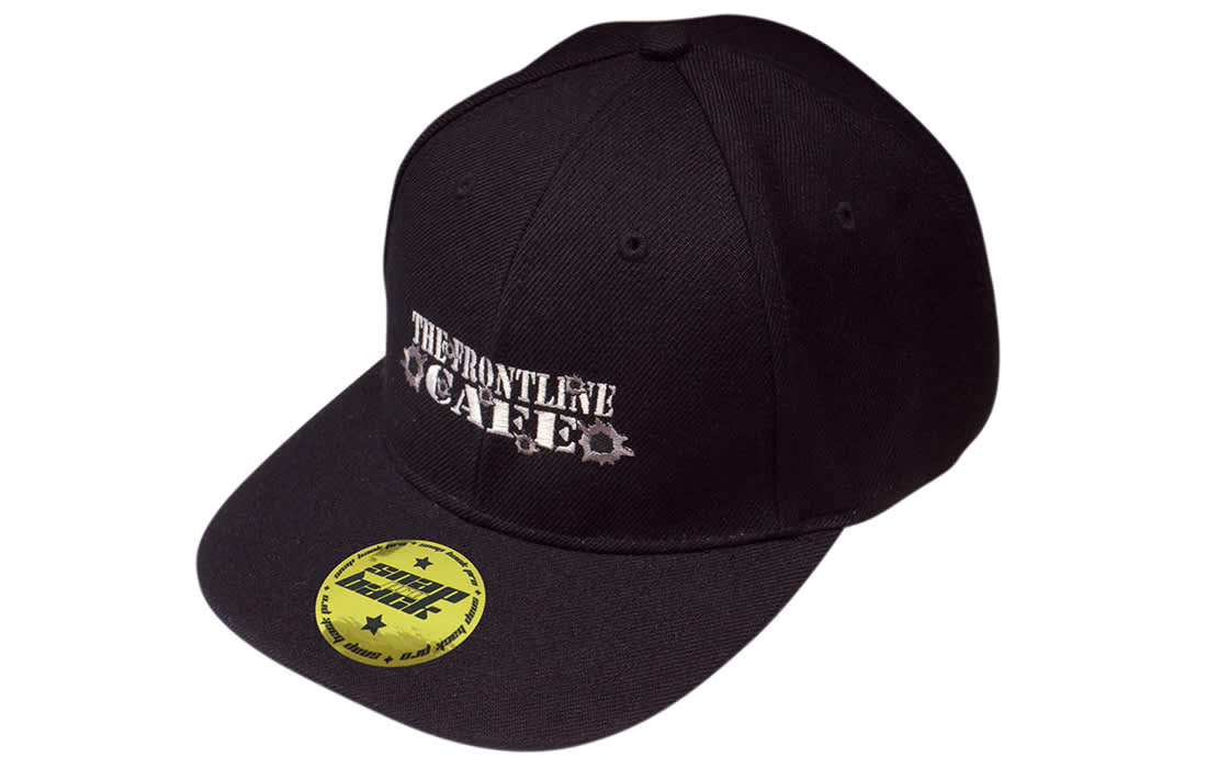 A black snapback cap with a logo on the front and a branded sticker on the peak. A black snapback cap with a logo on the front and a branded sticker on the peak.