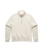 A beige half-zip crew jumper featuring a high collar and ribbed cuffs, with a logo on the front.