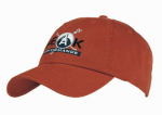 A washed chino twill cap in a reddish-brown colour with an embroidered logo on the front.