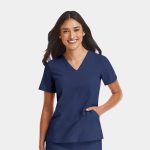 A navy women's v-neck top featuring short sleeves and a side pocket, with a logo on the sleeve.