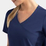 A navy mock wrap top with a v-neck and short sleeves, featuring contrast panels. It includes a logo.