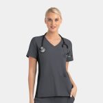 A mock wrap top in dark grey with contrast panels, featuring short sleeves and a V-neck design, with pockets.