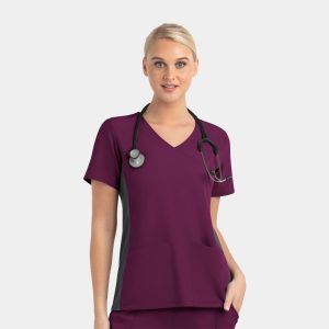 A mock wrap top in burgundy with grey contrast panels and a logo, worn by a model with a stethoscope.