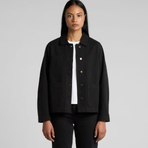 A black canvas chore jacket with a collared neckline and front pockets, modelled by a woman.