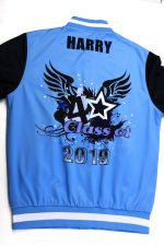 A blue sports jumper with black sleeves featuring a graphic design and a logo.
