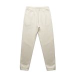 Cream track pants with a comfortable elastic waistband and tapered legs, featuring a logo.