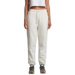 Cream track pants with an elastic waistband displayed on a model, featuring a logo.