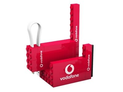 A red 4 in 1 cable set with a built-in phone stand, featuring logos and multiple connection options. 4 in 1 Cable Set + Phone Stand - Image 1