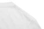 A white cotton t-shirt featuring a rounded neckline and shoulder seam detail. The shirt has a logo on it.