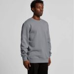 A grey hoodie with a standard crew neck and long sleeves is displayed on a male model.
